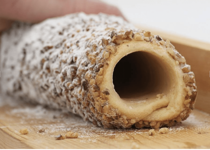 Skalicky Trdelnik is a traditional Slovak specialy - a cake made from rolled dough wrapped around a stick, grilled and topped with sugar and walnuts
